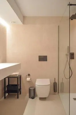 a bathroom with a toilet and a glass shower at Hotel De Zalm in Herentals