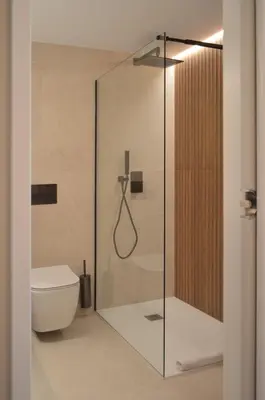 a glass shower in a bathroom with a toilet at Hotel De Zalm in Herentals