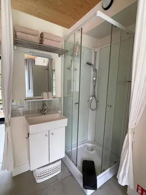 a bathroom with a shower and a sink at de graslelie in Schoten