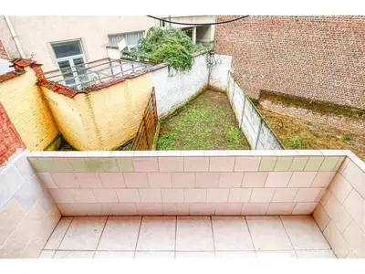 an outside view of a building with a tile floor at Appartements Brussel in Brussels