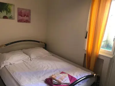 a bed in a room with a window at Appartements Brussel in Brussels