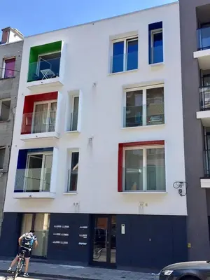 a person riding a bike in front of a building at Studio Liepoo in Ghent