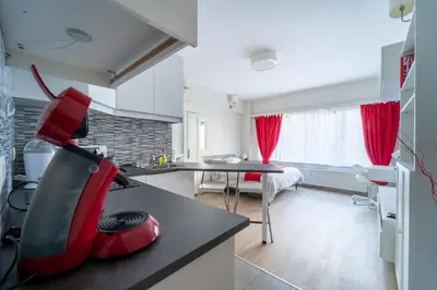 a kitchen with a red appliance on a counter at Luxury Studio In the EU Area in Brussels