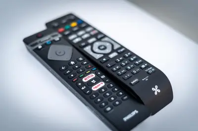 a remote control sitting on top of a table at Luxury Studio In the EU Area in Brussels