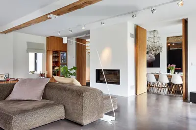 a living room with a couch and a table at B&B Park7 in Huldenberg