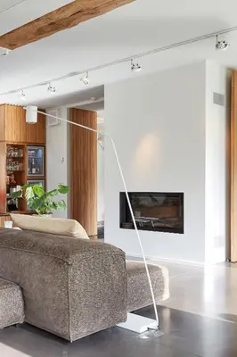 a living room with a couch and a tv at B&B Park7 in Huldenberg