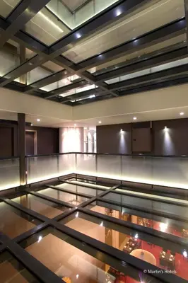 a glass display case in a room with food inside at Martin's Patershof in Mechelen