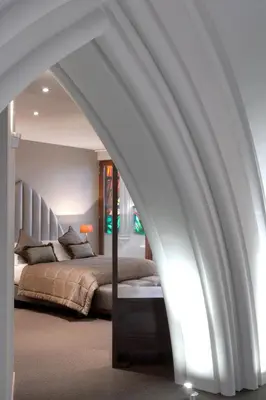 a bedroom with a bed with a white ceiling at Martin's Patershof in Mechelen