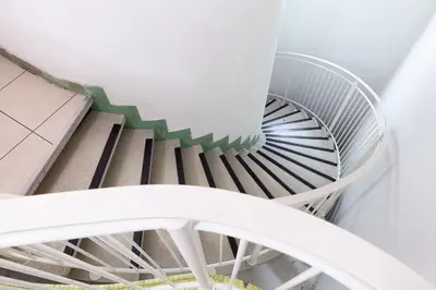 an overhead view of a spiral staircase at Antwerp Harbour Hotel in Antwerp