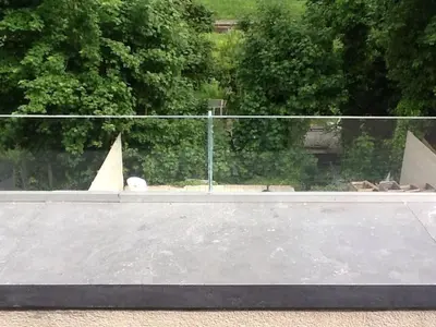 a large skateboard ramp in front of a fence at Akker duplex in Mortsel