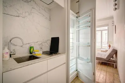 a kitchen with a sink and a counter at The Greenplace Lodge. Apartment in Heart of Antwerp. in Antwerp