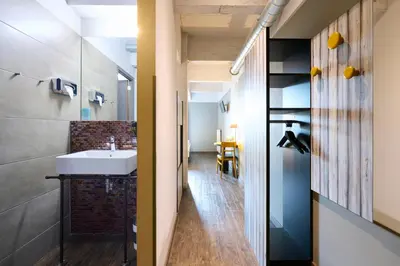 a bathroom with a sink and a mirror at MEININGER Hotels Bruxelles City Center in Brussels