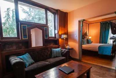 a living room with a couch and a bed at Charme Hotel Hancelot in Ghent