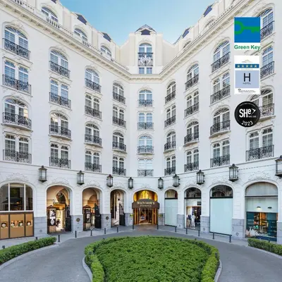 a large white building with a round courtyard at Steigenberger Icon Wiltcher's in Brussels