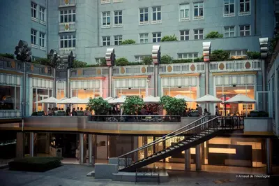 a large building with a staircase in front of it at Steigenberger Icon Wiltcher's in Brussels