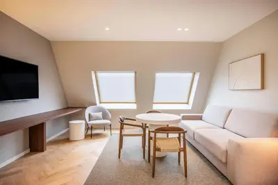 a living room with a couch and a table at Marriott Executive Apartments Brussels in Brussels