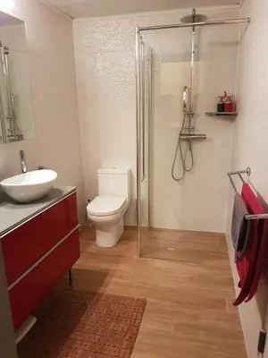 a bathroom with a toilet and a sink and a shower at Room Feliz in Zele