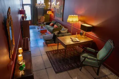 a living room with a couch and a table and chairs at Spirella in Brussels