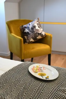 a plate of food on a table with a chair at Ask Lily in Westmeerbeek