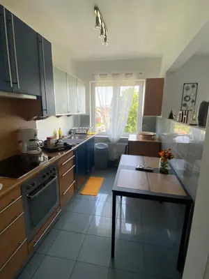 a kitchen with a table in the middle of it at Studio Brussels Expo in Brussels