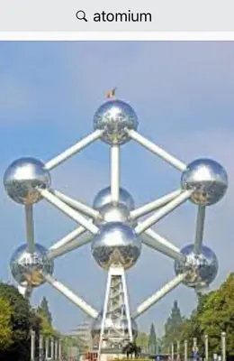 aatomium with a tower in the middle of a park at Studio Brussels Expo in Brussels