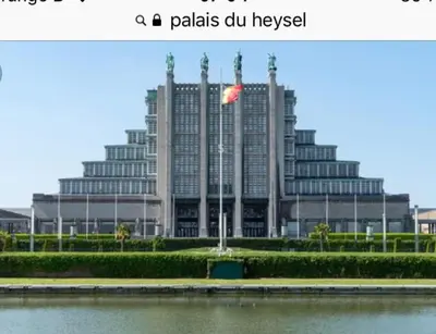 a large building with a flag in front of it at Studio Brussels Expo in Brussels