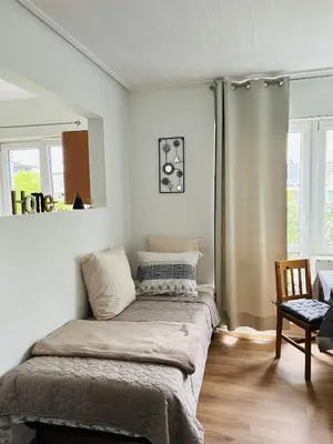 a bedroom with a large bed in a room at Studio Brussels Expo in Brussels