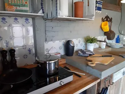 a kitchen with a stove with a pot on it at B&B LoFt 21 in Ravels
