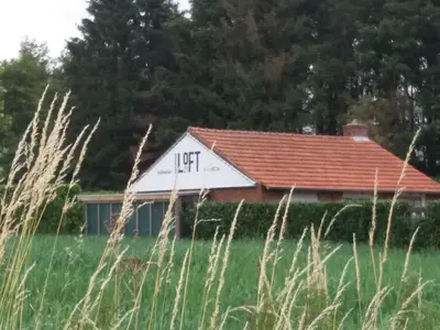 a house with the letter lick written on the side of it at B&B LoFt 21 in Ravels