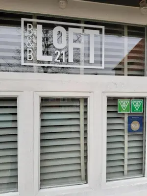 a sign in the window of a building with a lease sign at B&B LoFt 21 in Ravels