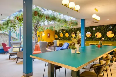 a conference room with a blue table and chairs at B&B HOTEL Brussels Centre Louise in Brussels