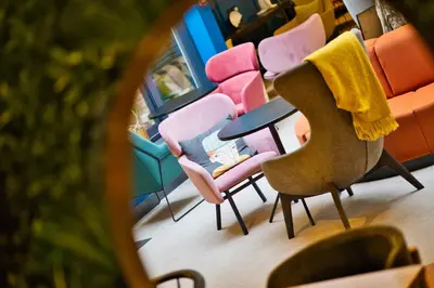 a group of chairs and a table on a train at B&B HOTEL Brussels Centre Louise in Brussels