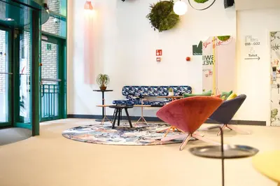 a living room with a couch and a rug at B&B HOTEL Brussels Centre Louise in Brussels