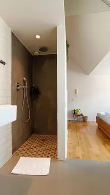 a bathroom with a shower in a room at Loftsuite in Ghent