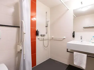 a bathroom with a shower and a sink at ibis Styles Hotel Brussels Centre Stéphanie in Brussels