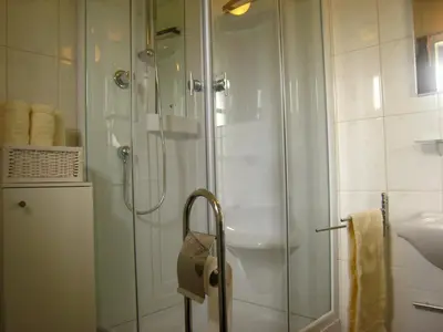 a bathroom with a shower with a glass door at Holiday Home in Zele near Laarne Castle in Zele
