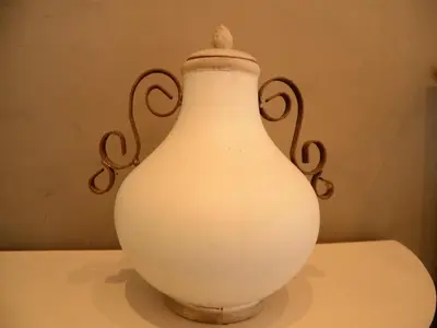 a white vase sitting on top of a table at Holiday Home in Zele near Laarne Castle in Zele