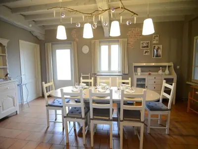 a kitchen and dining room with a table and chairs at Holiday Home in Zele near Laarne Castle in Zele