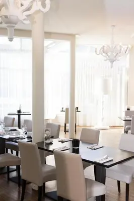a dining room with a table and chairs at Best Western Plus Aldhem Hotel in Grobbendonk