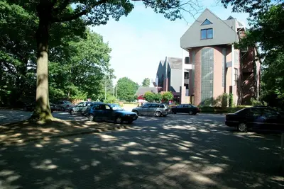 a group of cars parked on a street with a building at Best Western Plus Aldhem Hotel in Grobbendonk