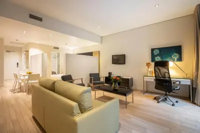 a living room with a couch and a table at B-aparthotel Grand Place in Brussels