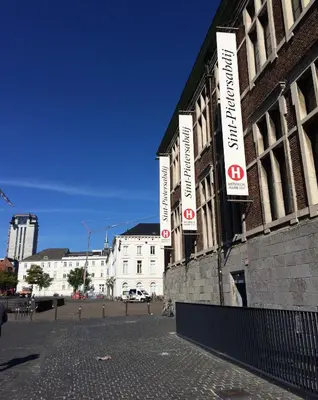 a building with signs on the side of it at Designflats Gent in Ghent