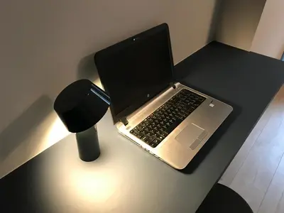 a laptop computer sitting on top of a desk at B&B Inn Between in Ghent