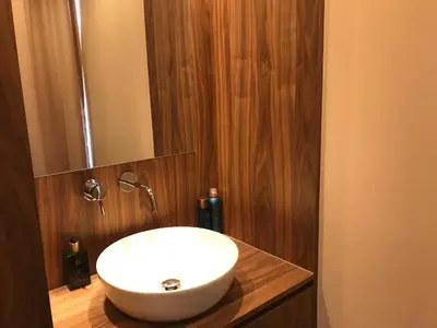 a bathroom with a white sink and a mirror at B&B Inn Between in Ghent
