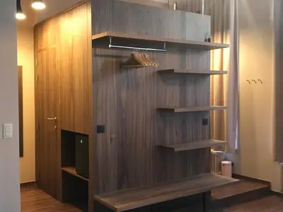 a wooden wall with shelves in a room at B&B Inn Between in Ghent