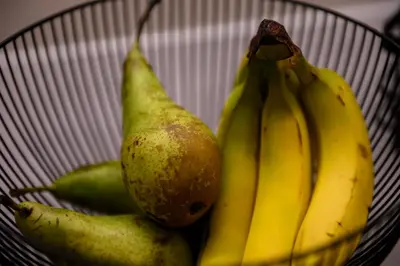 a basket with bananas and pears in it at B&B Hof ter Kouter in Dworp