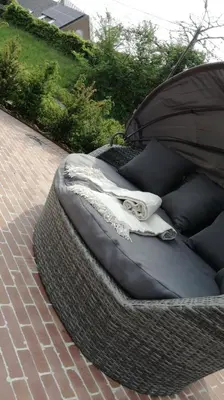 a large dog bed with a pair of scissors on it at B&B Hof ter Kouter in Dworp