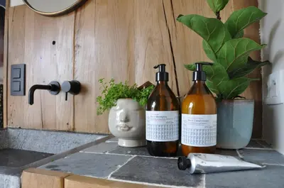 two bottles of wine sitting on top of a counter at Bed en Bezem in Laarne