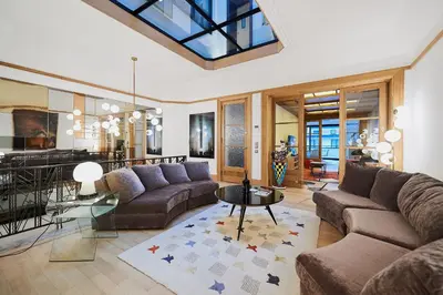 a living room with a couch and a table at B&B Suites 124 in Brussels