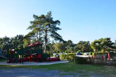 a playground in a park with at Safaritent at Camping GT Keiheuvel in Balen